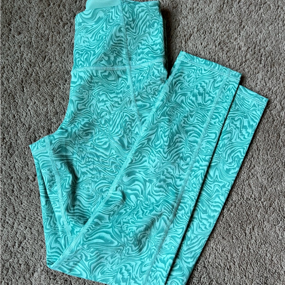Under armour green camo leggings.